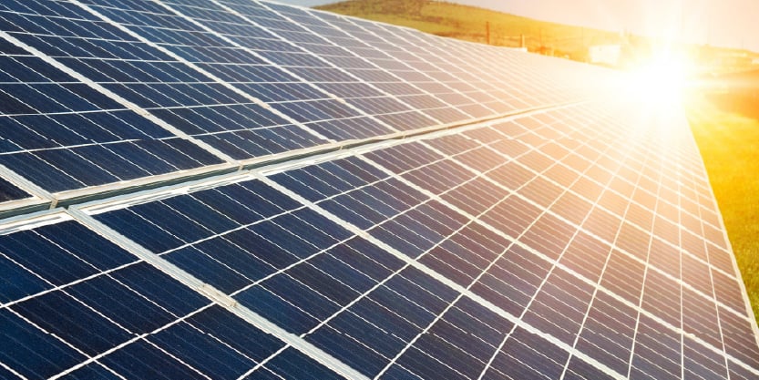solar panels in the sunset